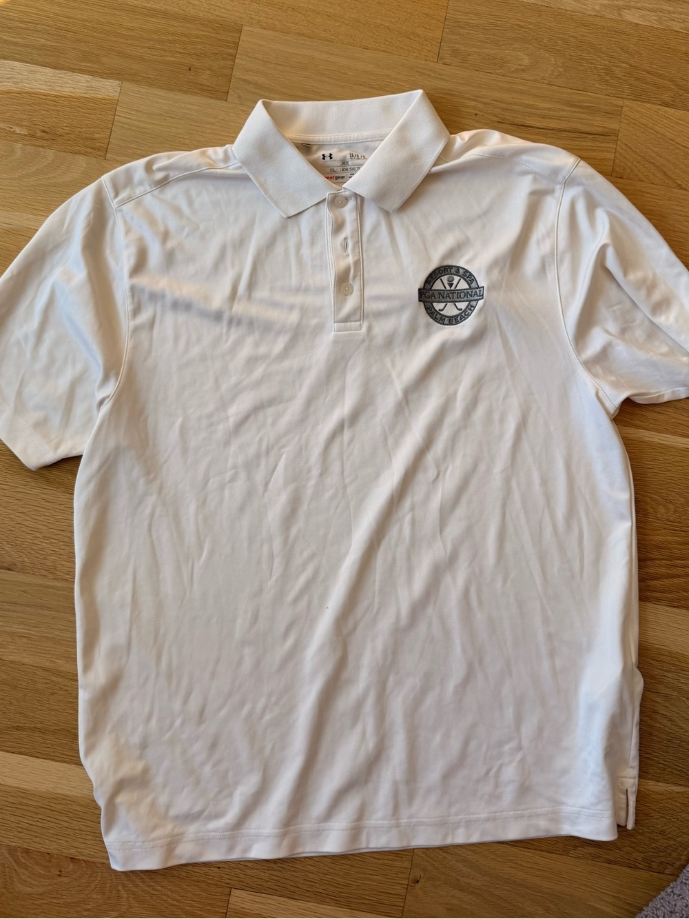Under Armour Menโs White Polo with Embroidered Chest Patch
